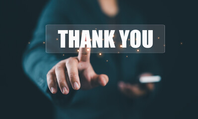 businessman showing the message thank you on a display screen. concept of thank you business,...