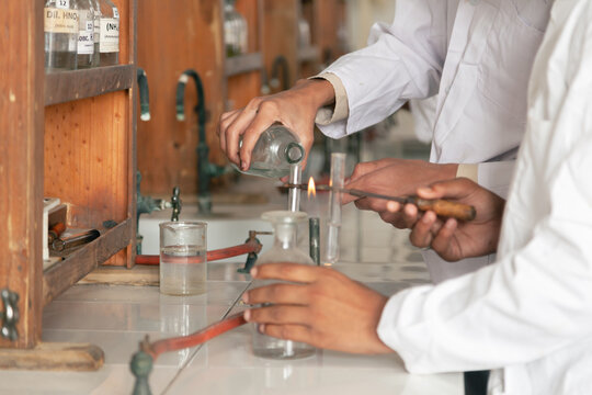 A Student engaged in practical experiments in the school's practical lab, showcasing hands-on learning and scientific exploration.