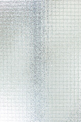 Drahtglasscheibe. Transparentes Sicherheitsglas mit geriffelter matter Oberfläche. Wired glass panel. Transparent safety glass with ribbed matt surface.