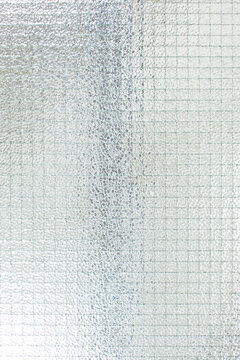 Drahtglasscheibe. Transparentes Sicherheitsglas mit geriffelter matter Oberfl&auml;che. Wired glass panel. Transparent safety glass with ribbed matt surface.
