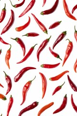Red chili peppers scattered on a white background.