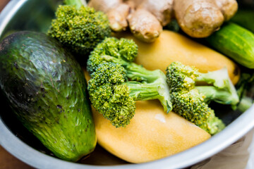 Cutting board with ingredients for preparing healthy quinoa bowl with avocado