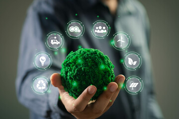 A person holds a green planet symbolizing sustainability, surrounded by eco-friendly icons...