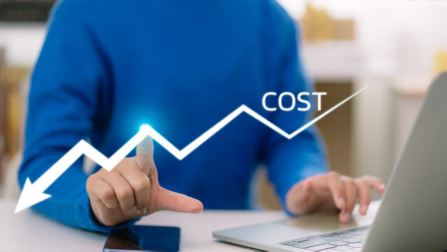Cost reduction concept. Cost Management, Women work on company cost saving. The word COST appears as a decrease with the down arrow. Economy recession, low budget, Effective business, Expense reduce