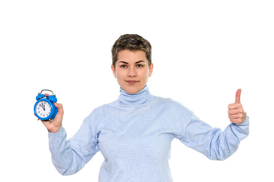 Confident Woman With Blue Alarm Clock Showing Positivity in Casual Sweater