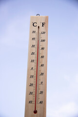 Thermometer shows high temperature in summer heat