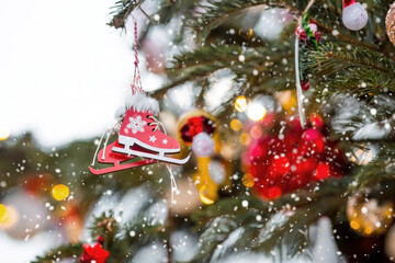 Beautiful festive decorations on the Christmas tree. Close-up. Beautiful Christmas background. The concept of decorations and decor for the new year. New Year's Card 2025