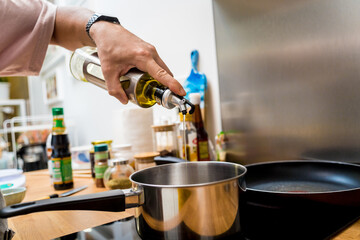 Chef at the kitchen preparing pumpkin porridge with tofu and vegetables