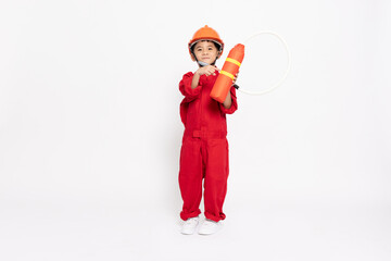 Asian little boy firefighter with fire extinguisher isolated on white background, Kid toy diy concept