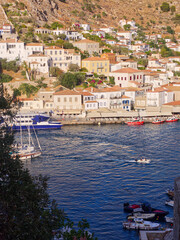Picturesque Hydra harbor in sunny summer day - golden hour, Saronic Gulf, Aegean Sea, Greece 