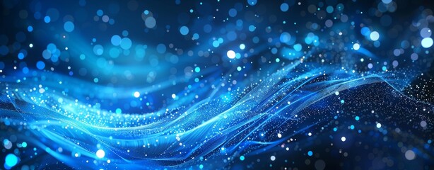Obraz premium Dynamic blue waves illuminated by shimmering light effects, perfect for backgrounds and abstract designs.