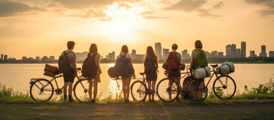 Silhouetted Cyclists at Sunset Over the City