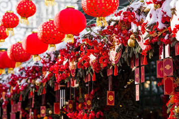 Fototapeta premium Chinese red Christmas lanterns on Tverskaya Street in Moscow. Close-up. The first ever meeting of the Chinese New Year 2024 in Moscow.