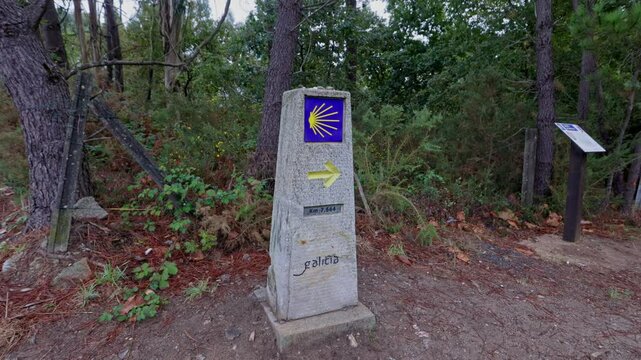 Stone milestone indicating the way to santiago de compostela on the camino de santiago in spain