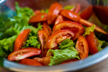 Chef at the kitchen preparing spicy glass noodle salad