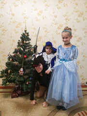 new year, christmas, children standing by the new year tree, snowman, holidays, childhood, boy, winter, girl, mom, mother, new year decor, cinderella, musketeer, horse, new year outfits, masquerade