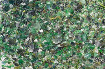 Old broken pieces of glass at the recycling centre.