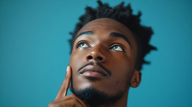 Human face expressions emotions and feelings Handsome young African American man looking up with thoughtful and skeptical expression holding finger on his chin trying to remember somet : Generative AI