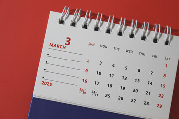 Monthly calendar template for the new year 2025 desk calendar,on red background.