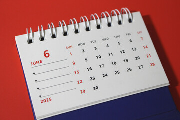 Monthly calendar template for the new year 2025 desk calendar,on red background.