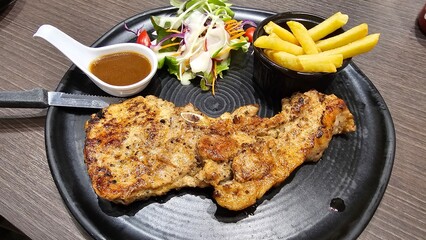 pork chop steak with salad 
