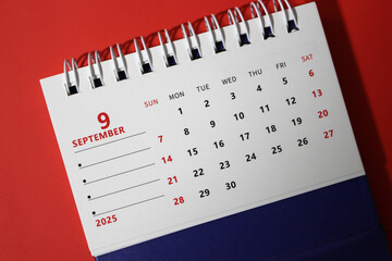 Monthly calendar template for the new year 2025 desk calendar,on red background.