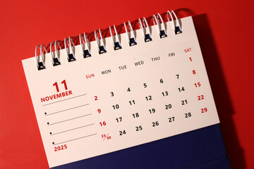 Monthly calendar template for the new year 2025 desk calendar,on red background.