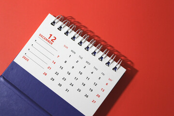 Monthly calendar template for the new year 2025 desk calendar,on red background.