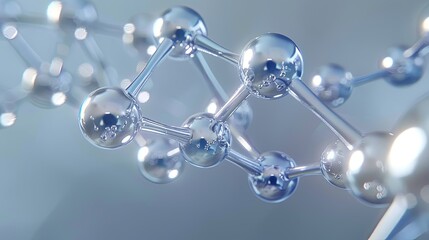 Abstract close-up of a metallic molecule model, showcasing its intricate structure with reflective spheres and connecting rods against a soft gray background.