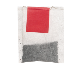 New tea bag with red tab isolated on white