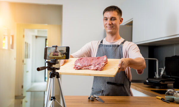 The chef is broadcasting live from workshop how to prepare a beef steaks on the electric grill