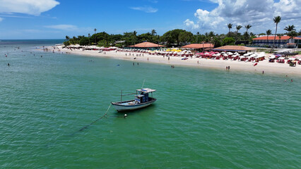 Fototapeta premium Boat Sailing In Santa Cruz Cabralia Bahia Brazil. Idyllic Beach. Nature Landscape. Bahia Brazil. Tourism Background. Boat Sailing In Santa Cruz Cabralia Bahia. Brazil Discovery Coast.
