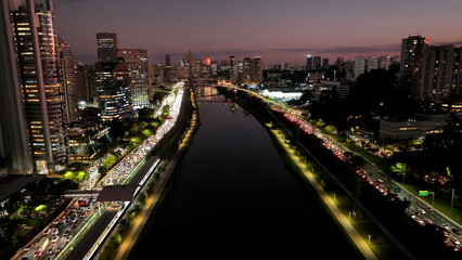Fototapeta premium Road Traffic At Sunset City In Sao Paulo Brazil. Cityscape Bridge. Traffic Road. Sao Paulo Brazil. City Skyline Landscape. Road Traffic At Sunset City In Sao Paulo Brazil.