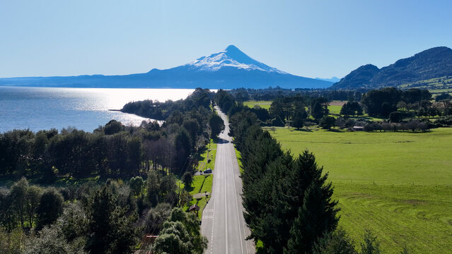 Patagonia Road At Puerto Varas In Los Lagos Chile. Volcano Landscape. Sky Clouds Background. Los Lagos Chile. Road Trip Mountain. Patagonia Road At Puerto Varas In Los Lagos Chile.