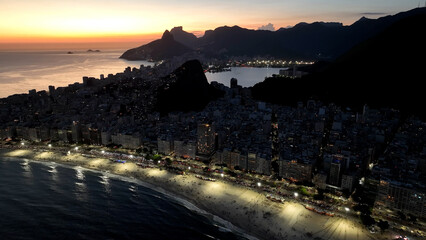 Fototapeta premium Sunset Skyline At Copacabana Beach In Rio De Janeiro Brazil. Sunset Dusk Skyline. Tourism Scene. Copacabana Beach At Rio De Janeiro Brazil. Sunset Evening Skyline. Sunset Skyline.