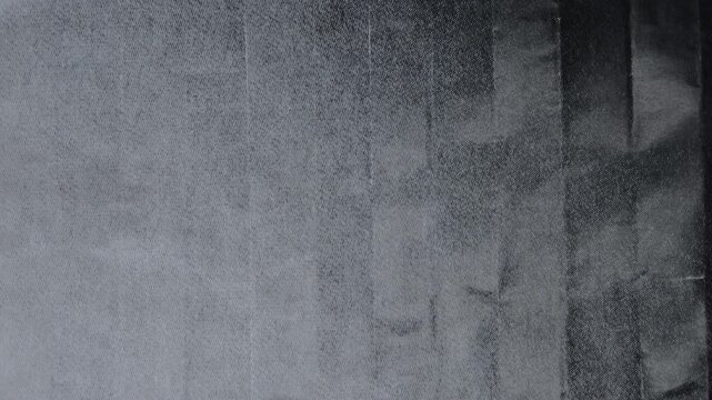 bright led light is moving over copy paper surface with dark ink on it, halftone dots print to test black toner ink background, paper video overlay via blend mode.