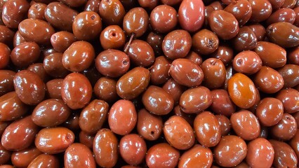 Close-Up of Juicy Olives in Various Colors - Green, Black, Purple, Red, Pink, and Brown Olives market