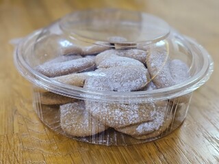 Buttery Crescent-Shaped Cookies with Powdered Sugar on Baking Sheet or in Box