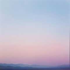 Fototapeta premium Serene landscape with pastel colors at dusk, featuring soft rolling mountains and a gradient sky. Perfect for backgrounds or calming visuals.