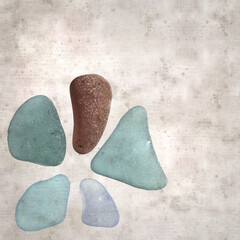 stylish textured old paper background with sea glass pebble pieces 
