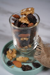 different variety of nuts in a glass