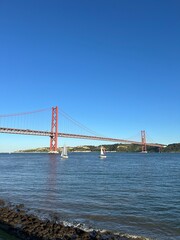 Suspension bridge crossing the river Tagus in Lisbon Portugal. The 25 de Abril Bridge. 