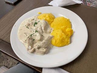 Chicked and mamaliga, traditional dish in Romania