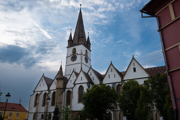 The picturesque and colorful medieval town Sibiu with a prominent place for the Sibiu Lutheran Cathedral, Sibiu, Romania