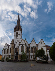 The picturesque and colorful medieval town Sibiu with a prominent place for the Sibiu Lutheran Cathedral, Sibiu, Romania