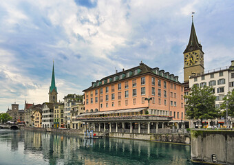 Fototapeta premium Zurich view from the river area with the view of St. Peter and Fraumunster church clock towers.