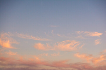 Amazing clouds at sunset. Warm evening.