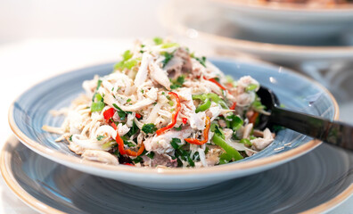 Salad of pulled chicken and paprika on the table.