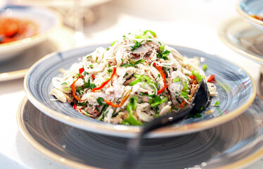 Salad of pulled chicken and paprika on the table.