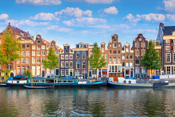 Amsterdam. Panoramic view of the historic city center of Amsterdam. Traditional houses and bridges of Amsterdam. An early quiet morning.  Europe, Netherlands, Holland, Amsterdam.